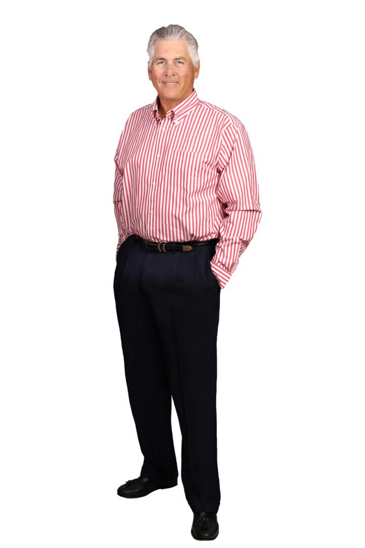 Person wearing formal attire, standing confidently